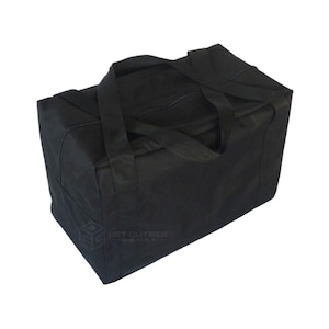 May include: A black rectangular tote bag with two handles and a zipper closure. The bag is made of a durable fabric and has the text "GET OUTSIDE GAMES" printed on the side.