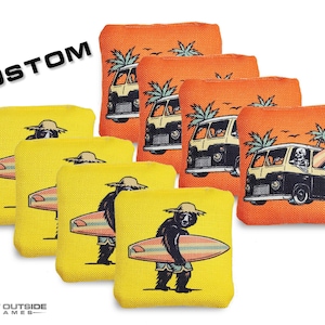 May include: A set of custom cornhole bags in yellow and orange. The yellow bags feature a bear with a surfboard, while the orange bags depict a vintage van with a palm tree. The word "CUSTOM" is printed in black.