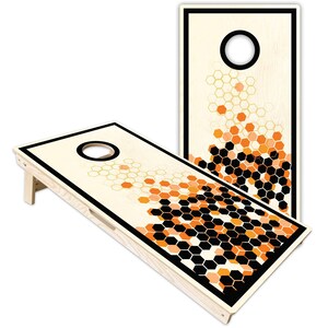 May include: Two rectangular wooden cornhole boards featuring a light natural wood grain finish. Each board has a circular hole at the top and a graphic pattern of black, orange, and light orange hexagons that transition from dense to sparse.