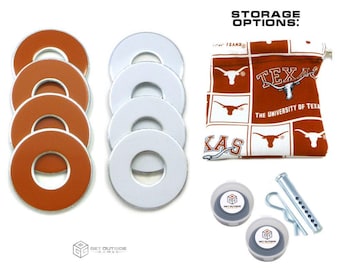 May include: A collection of game pieces, including orange and white circular pieces, two gray and white game pieces, and a metal pin. A drawstring bag with a Texas Longhorns theme is also included. The text "STORAGE OPTIONS:" is visible.