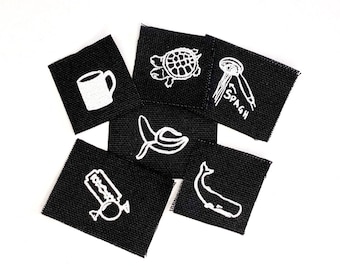 Set of Little Patches Printed on Black Cotton Canvas