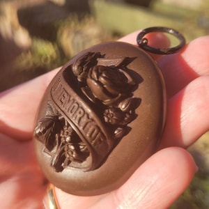 Victorian Mourning Locket: Vulcanite Memento Mori Pendant with Hair