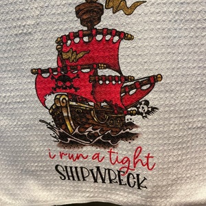 I Run A Tight Shipwreck Kitchen Dish Microfiber Waffle Weave Towel. White or Cream Colored towel. Pirate Ship Flag with Skull & Crossbones