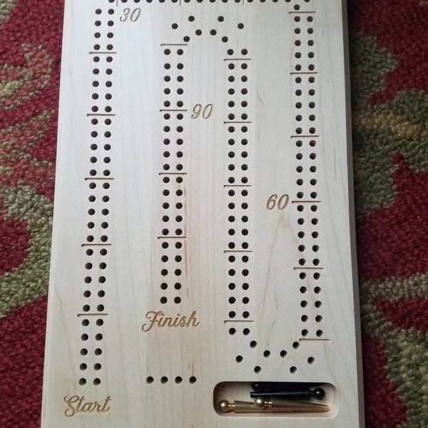 Cribbage board with large holes for the visually impaired. Warning: Contains small parts that could be a choking hazard for small children.