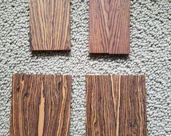 May include: Four pieces of wood with a dark brown and light brown striped pattern. The wood is labeled A, B, C, and D.