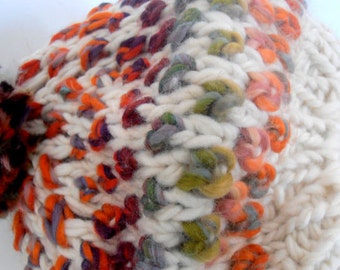 May include: A white knitted hat with colorful yarn accents. The hat is made with a chunky yarn and has a textured look.