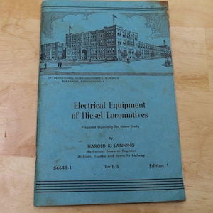 May include: A vintage book titled "Electrical Equipment of Diesel Locomotives" by Harold K. Lanning. The cover is teal with an illustration of a building and text from the International Correspondence Schools, Scranton, Pennsylvania. Part 5, Edition 1.