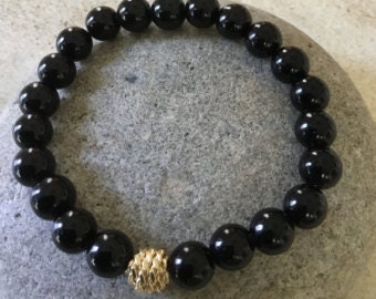NEGATIVE EMOTIONS-SORROW- Ego. Black Onyx Gemstone Bracelet. Beaded Bracelet.  Stretch Bracelet. Gold Knot Bead.