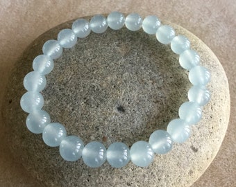 CALMING - CLEANSING - Aquamarine Jade Bracelet. Beaded Stone Bracelet. Water of the Sea.  March Birthstone . Throat Chakra. Simple Stretch .