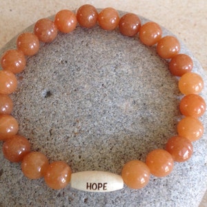POSITIVE. HEALING. Peach Aventurine Beaded Gemstone Bracelet. Unisex. Wood &quot;HOPE&quot; Bead. Simple, Stretch Bracelet. Meditation/Yoga Bracelet.