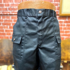 Size 48 New Old Stock black short trunks 6 pockets pants.