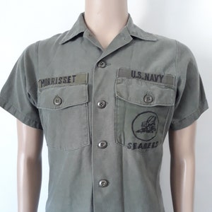 U.S. Navy Seabees combat utility short sleeve shirt size 14 1/2x33 with patches.