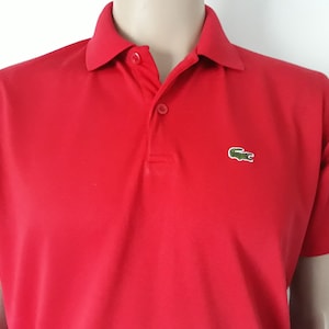 80&#39;s Lacoste tennis knit shirt red size 4/medium 100% cotton made in France.