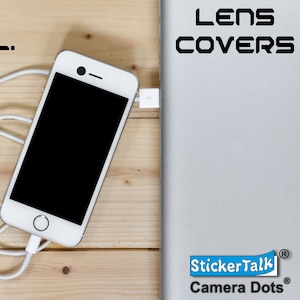May include: A white smartphone with a black screen and a white charging cable is on a light wood surface. The text "SECURE. FUNCTIONAL. EFFECTIVE." is at the top left. The text "LENS COVERS" is at the top right.