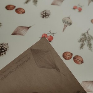 May include: A brown paper gift wrap with a white background and a repeating pattern of pine cones, acorns, berries, and ornaments. The text "www.babybottle.com" is printed on the paper.