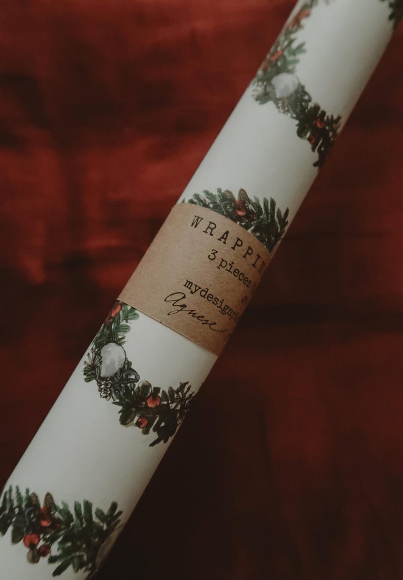 May include: A roll of white wrapping paper with a green and red floral design. The paper is labeled "Wrapping 3 pieces" and "mydesignprints Agneese".