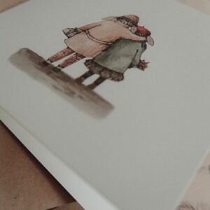 May include: A watercolor illustration of two people, a man and a woman, standing close together. The man is wearing a brown coat and a hat, and the woman is wearing a green coat and a red hat. They are both looking away from the viewer.