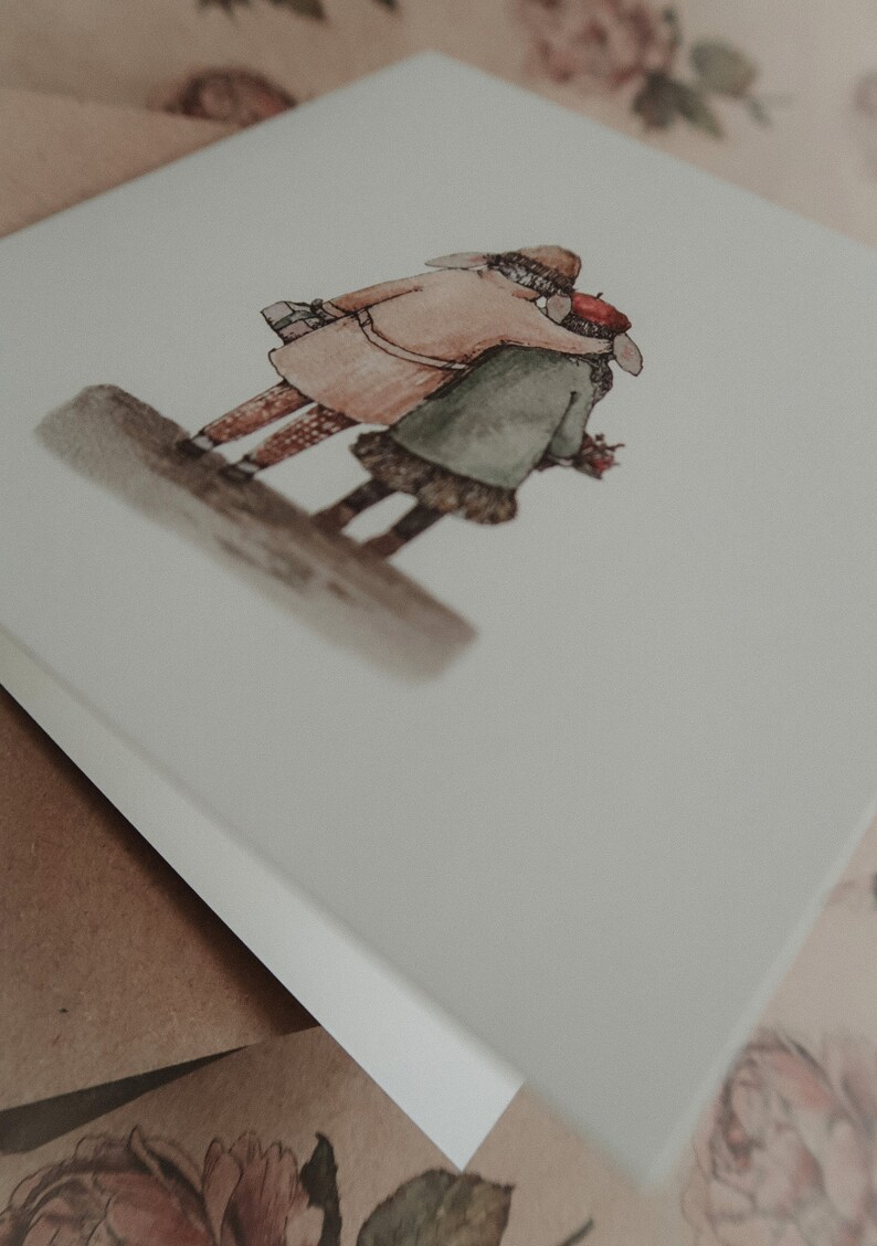 May include: A watercolor illustration of two people, a man and a woman, standing close together. The man is wearing a brown coat and a hat, and the woman is wearing a green coat and a red hat. They are both looking away from the viewer.