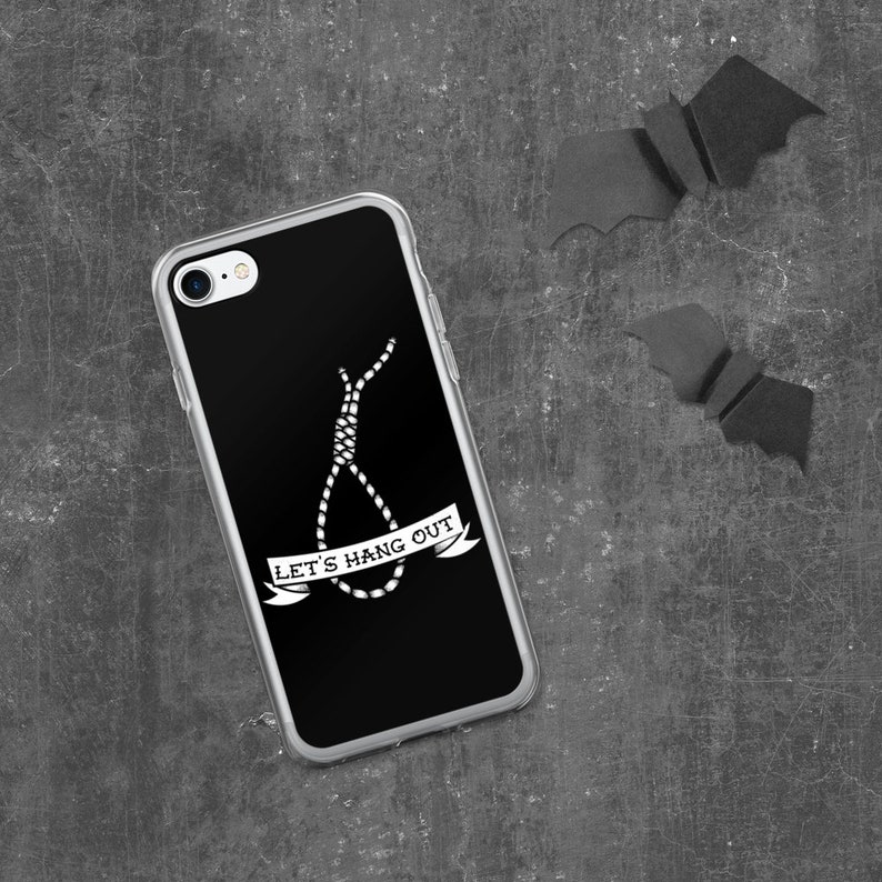 May include: A black phone case with a white graphic of a noose and the text "Let's Hang Out".
