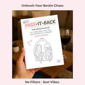 May include: A white "PASS-IT-BACK" friendship journal with pink and green text, held in a person's hand. The journal features a line drawing of two people forming a heart with their hands. Text reads "Unleash Your Bestie Chaos" and "No Filters - Just Vibes."