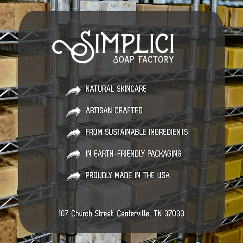 May include: A close-up of a shelf stocked with bars of handmade soap. The soap is made with natural ingredients and packaged in earth-friendly materials. The sign above the soap reads "SIMPLICI SOAP FACTORY". The sign also lists the company's values: "Natural Skincare", "Artisan Crafted", "From Sustainable Ingredients", "In Earth-Friendly Packaging", and "Proudly Made in the USA". The address of the soap factory is listed below the sign: "107 Church Street, Centerville, TN 37033".
