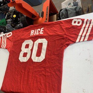 Rice Evokes Memories While Modeling 49ers Throwback Jersey