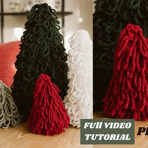 May include: Four yarn Christmas trees in different sizes and colors: green, white, red, and olive green. The trees are made of yarn wrapped around a cone shape. The image includes the text "Full Video Tutorial PDF".