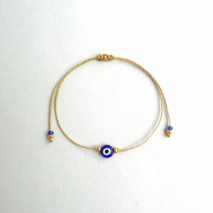 Gold string Evil Eye Bracelet 24k Gold plated beads Minimalist Blue Eye Lucky Bracelet Protection Greek jewelry Good luck gift Wish bracelet Gold