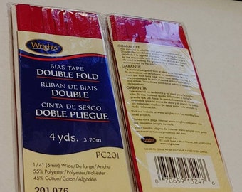 May include: Two packages of Wrights scarlet double fold bias tape in clear plastic wrapping. Each package contains 4 yards of 1/4 inch wide tape made of 55% polyester and 45% cotton. The labels feature the product code PC201 and number 201 076.