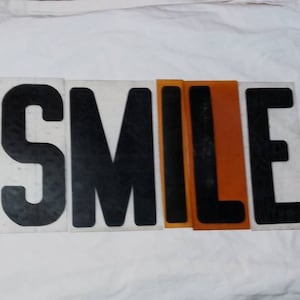 Plastic Sign letters. Vintage 1980&#39;s. 8 3/4 long by 1 3/4 - 5 7/8 inches wide. NO LETTER D. Some clear, some reddish orange.