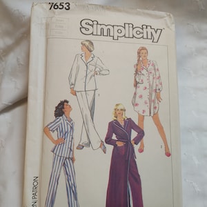 May include: Simplicity sewing pattern number 7653 for a pajama set and robe. The pattern includes four different styles: a white pajama set, a floral print pajama set, a striped pajama set, and a long robe. The pattern is designed by J. Maerino.