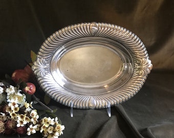Silver plate oval serving piece with fluted edges.  Perfect for the holiday gatherings