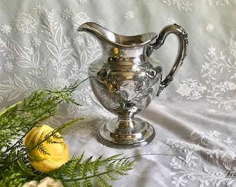 Antique English quadruple plate cream pitcher with repousse flowers