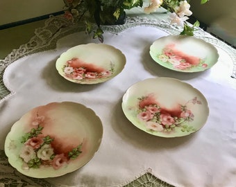 Limoges luncheon or dessert plates. Hand painted in russet and cream roses beautifully rendered on scalloped  plates.