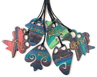 Wood pendants with peace in many languages!