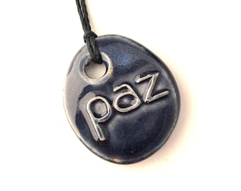 Spanish word for peace on a Blue Ceramic Pendant! Paz!