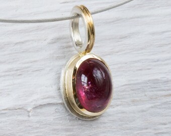 handmade pendant in silver, gold bezel, set with pink tourmaline, medium size