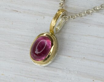 handmade pendant in silver, gold bezel, set with pink tourmaline, medium size