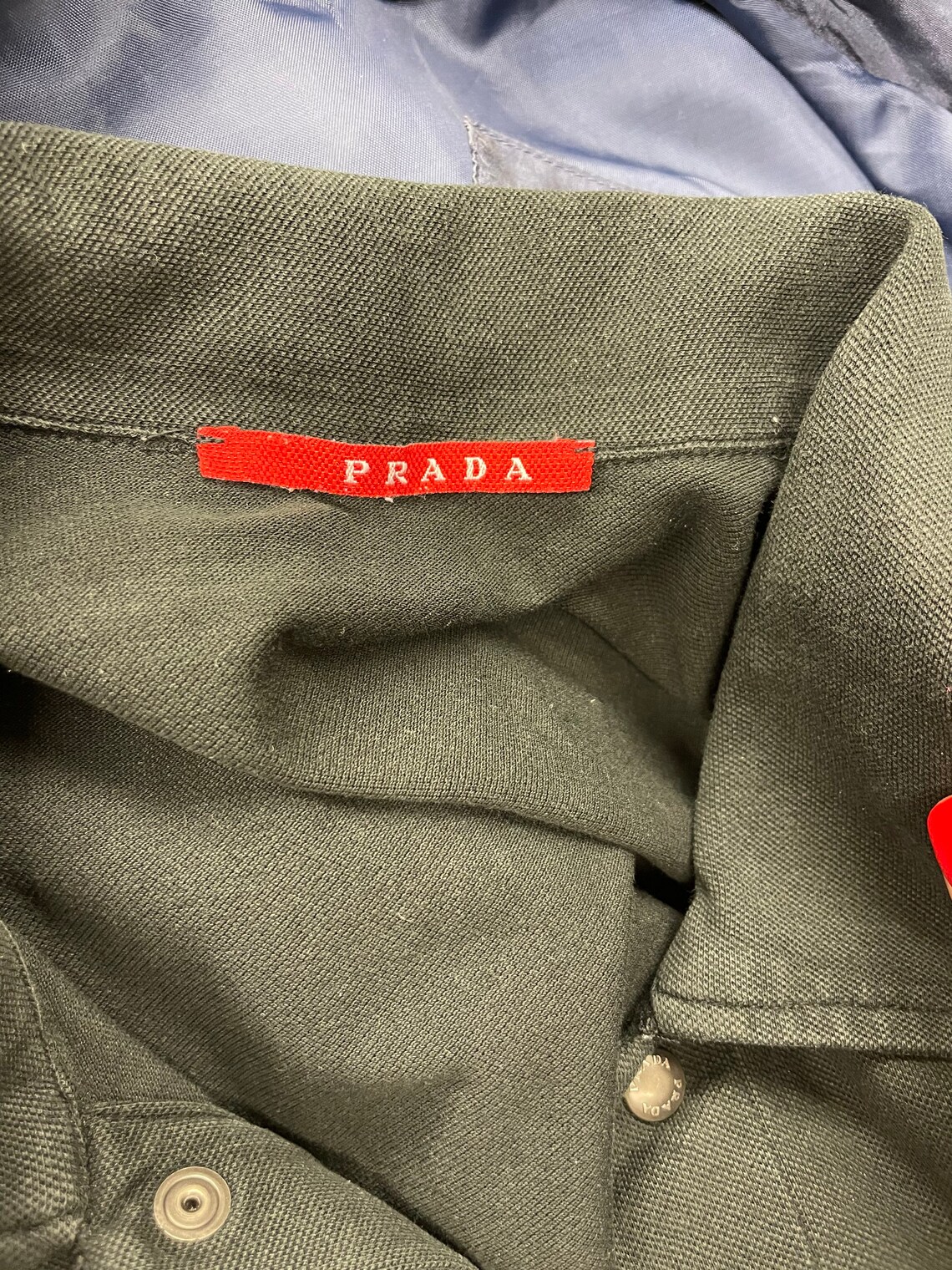prada polo red logo