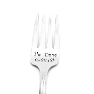 May include: Silver fork with the words "I'm Done" and the date "9.29.21" engraved on the handle.