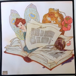 May include: An illustration featuring a fairy with red hair and iridescent wings, nestled among open books and papers. A spilled inkwell, a vase, and pink flowers add to the whimsical scene. The artwork has a vintage, storybook style.