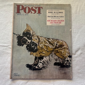 May include: Vintage April 2, 1949, The Saturday Evening Post magazine cover. The illustration features a black and white Cocker Spaniel wearing a yellow raincoat and hood in the rain. The magazine title and date are at the top.