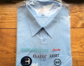 Vintage 18”collar Deadstock short sleeved blue shirt, chest 56”. New old stock in pack.