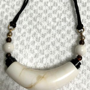 Vintage Sinahi style necklace with large, curved shell or bone pendant