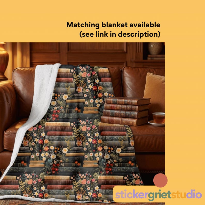 May include: A cozy blanket with a floral and book design. The blanket features a dark background with stacks of books and colorful flowers. The reverse side is white. Text on the image reads: Matching blanket available (see link in description).