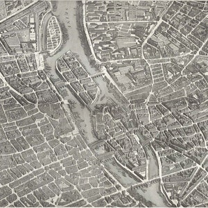 May include: A detailed black and white aerial map of a city with a river winding through it. The map shows the layout of the city streets and buildings.
