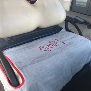 Gray Terry Cloth Golf Cart Seat Cover saying Golf in Red