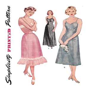 May include: Vintage Simplicity Printed Pattern featuring illustrations of three dresses. The dresses include a pink and white lingerie set, a black slip dress, and a blue dress with spaghetti straps. The pattern is for women's clothing.