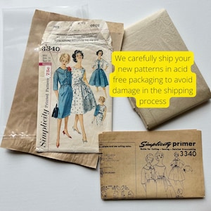 May include: Vintage Simplicity sewing pattern packet, size 14, featuring illustrations of dresses. The packet is accompanied by a primer and is packaged in acid-free packaging. The text on the packet reads "Simplicity Printed Pattern 75c".