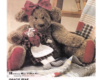 May include: A handmade brown teddy bear with a red plaid bow and red accents on its paws. The bear is holding a small doll with a red heart and plaid dress. The text reads "Gracie Bear" and "Gracie, seated is 11 1/2 inches high...Anne comes complete with clothes and is 9 inches tall."